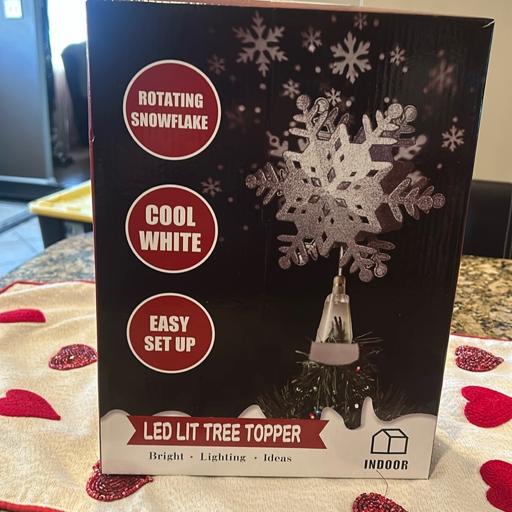 LED tree topper with snowflake ceiling projections
